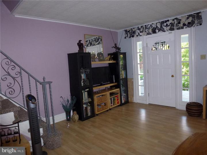 7028 Cresheim Road Philadelphia, PA 19119 - Photo 7 of 23 a living room with furniture and a flat screen tv