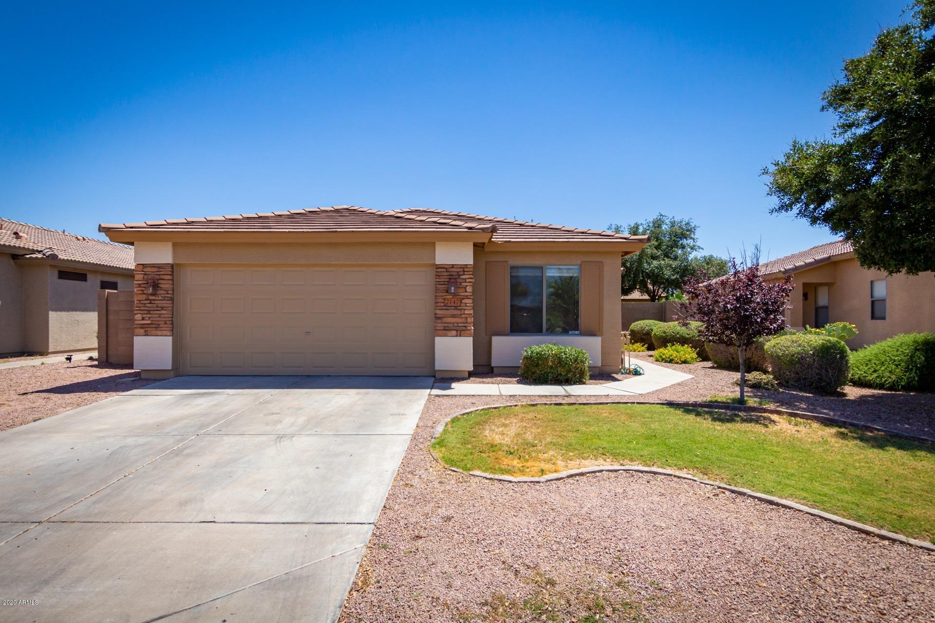 2147 West Tanner Ranch Road Queen Creek, AZ 85144 - Photo 2 of 26 a view of a house with a yard