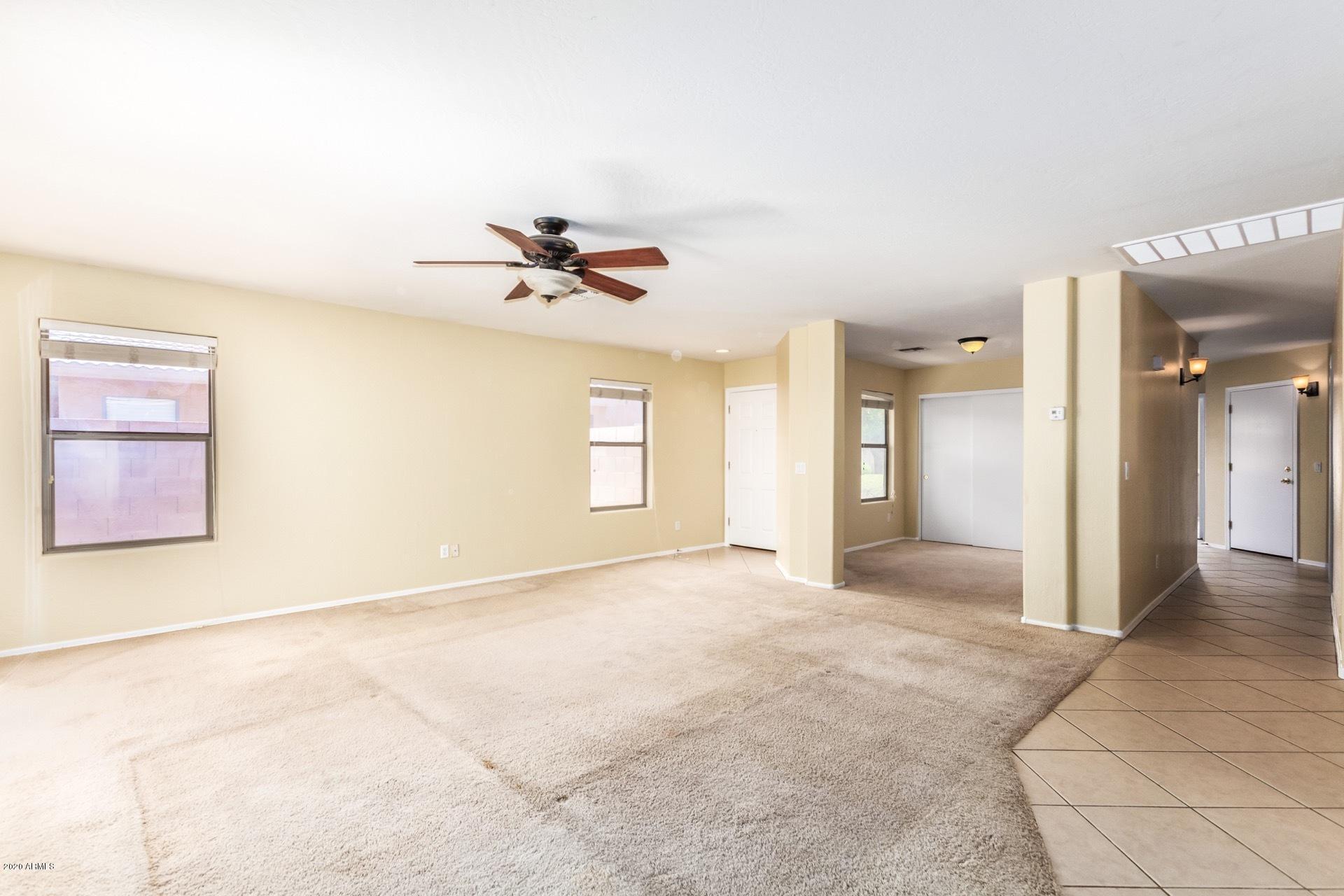 2147 West Tanner Ranch Road Queen Creek, AZ 85144 - Photo 4 of 26 a view of an empty room with a window