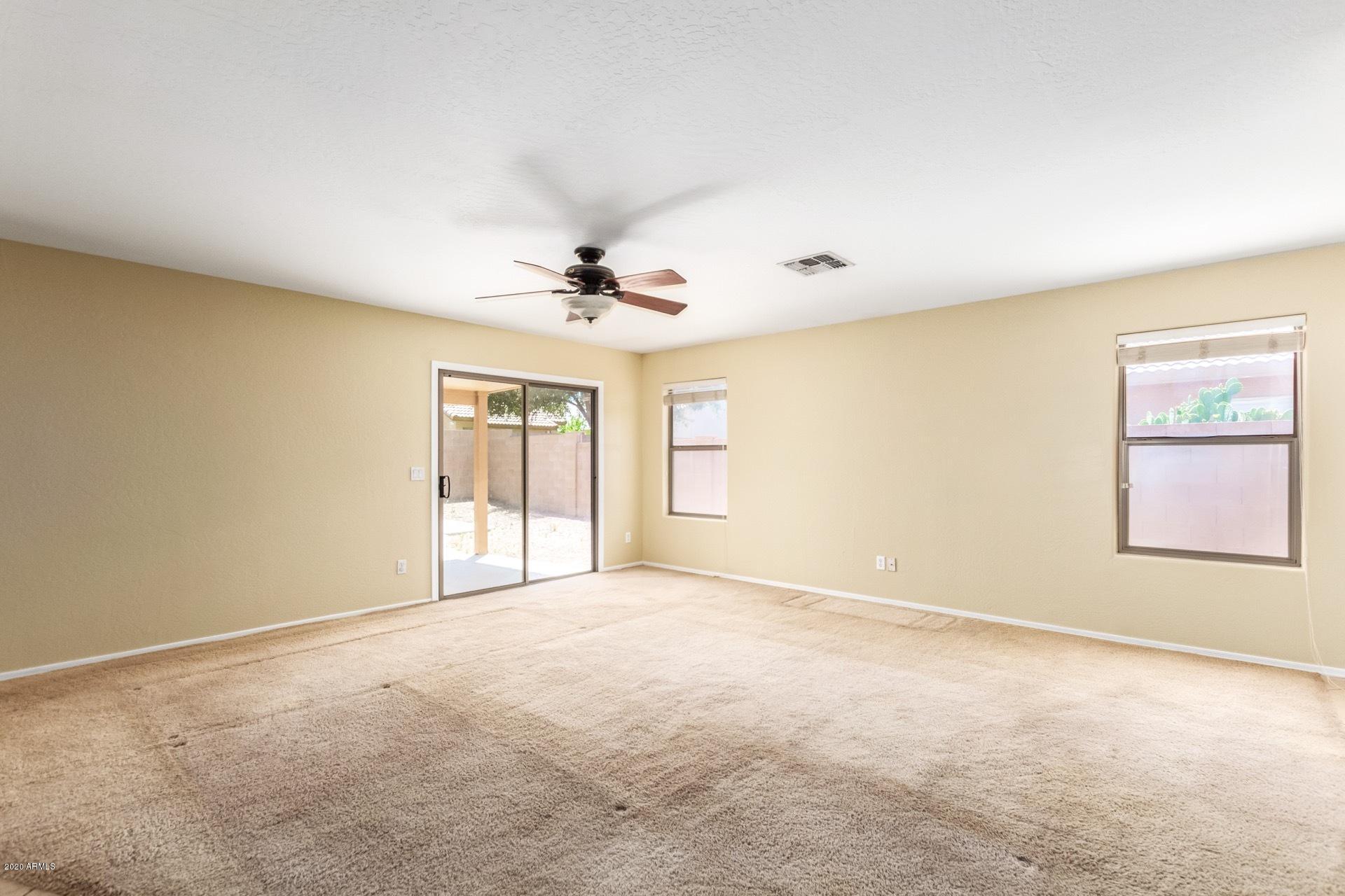 2147 West Tanner Ranch Road Queen Creek, AZ 85144 - Photo 5 of 26 a view of an empty room with a window