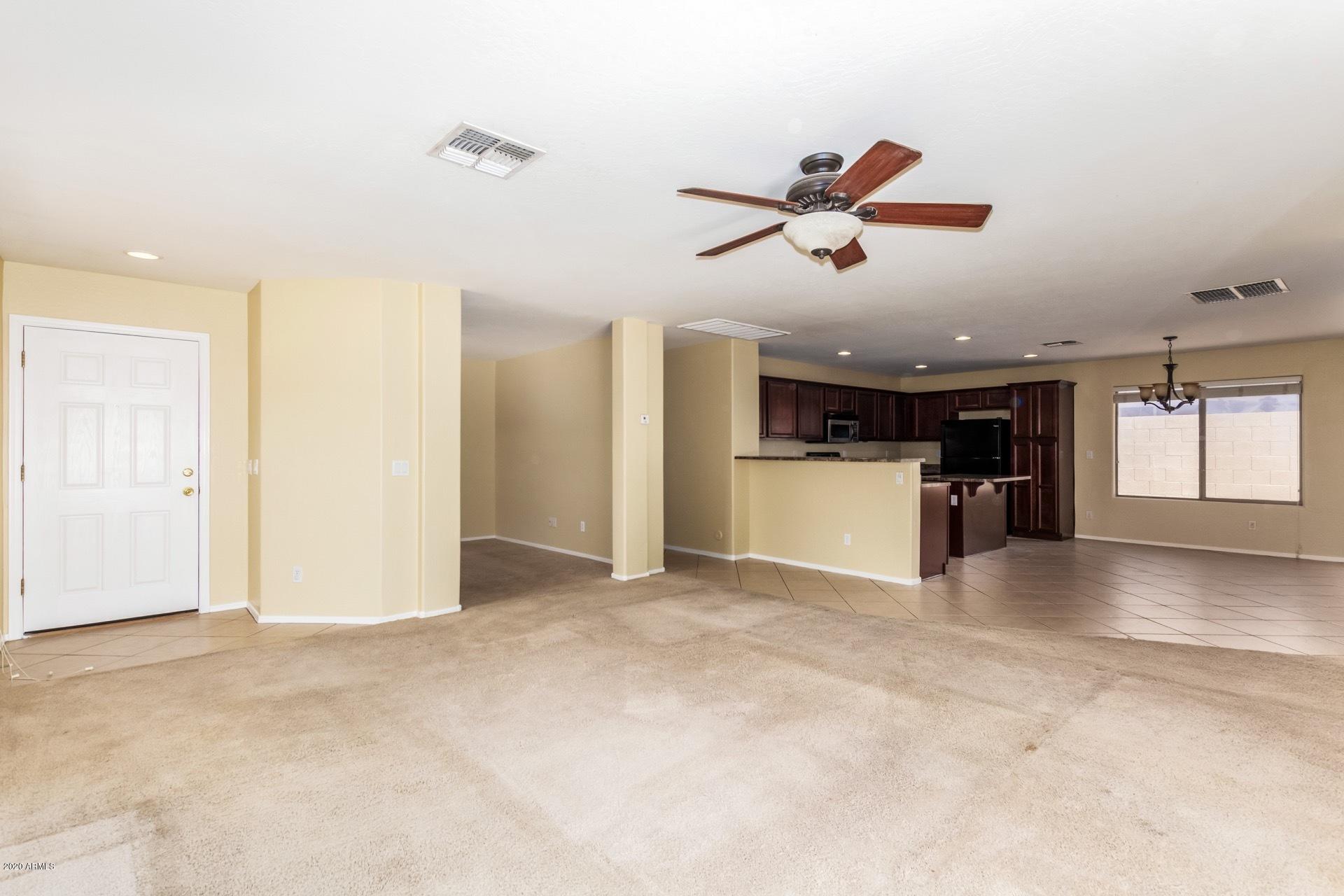 2147 West Tanner Ranch Road Queen Creek, AZ 85144 - Photo 7 of 26 a view of an empty room with a window