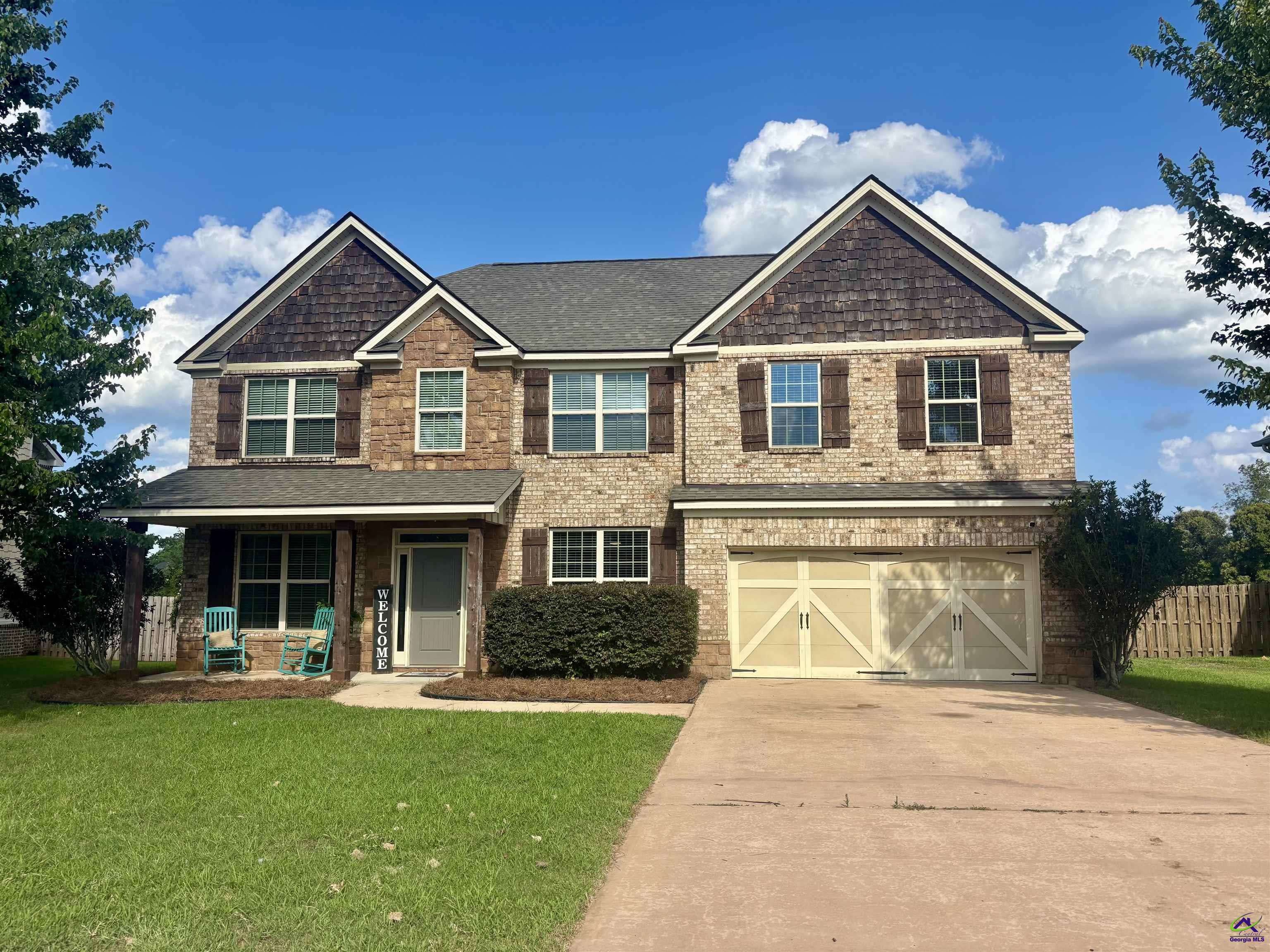 600 Post Oak Way Warner Robins, GA 31088 - Photo 1 of 50 front view of a house with a yard