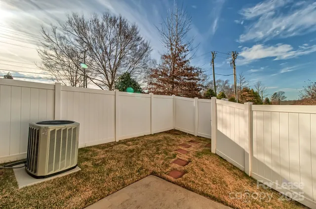 a view of a pathway with a garden