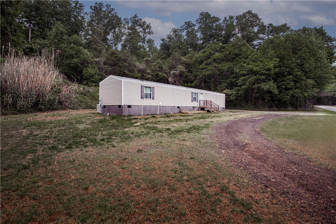 1188 Old Liberty Road Easley, SC 29640 - Photo 4 of 28 This manufactured home offers a private yard and easy access to nature.