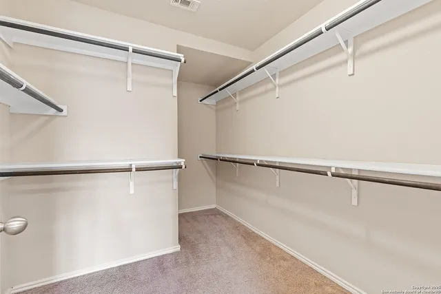 a view of an empty walk in closet