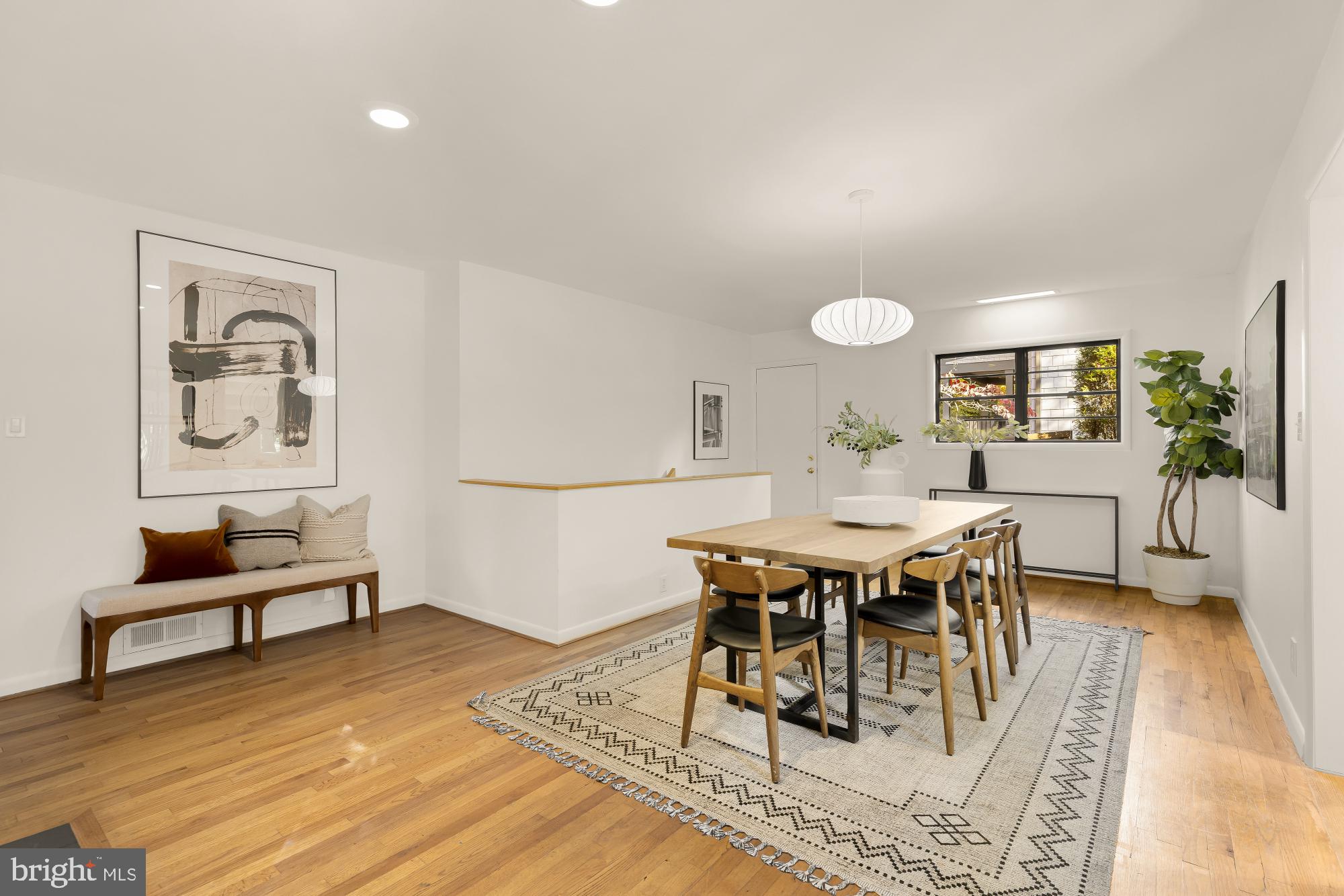 4911 Falstone Avenue Chevy Chase, MD 20815 - Photo 13 of 58 a view of a dining room with furniture and wooden floor