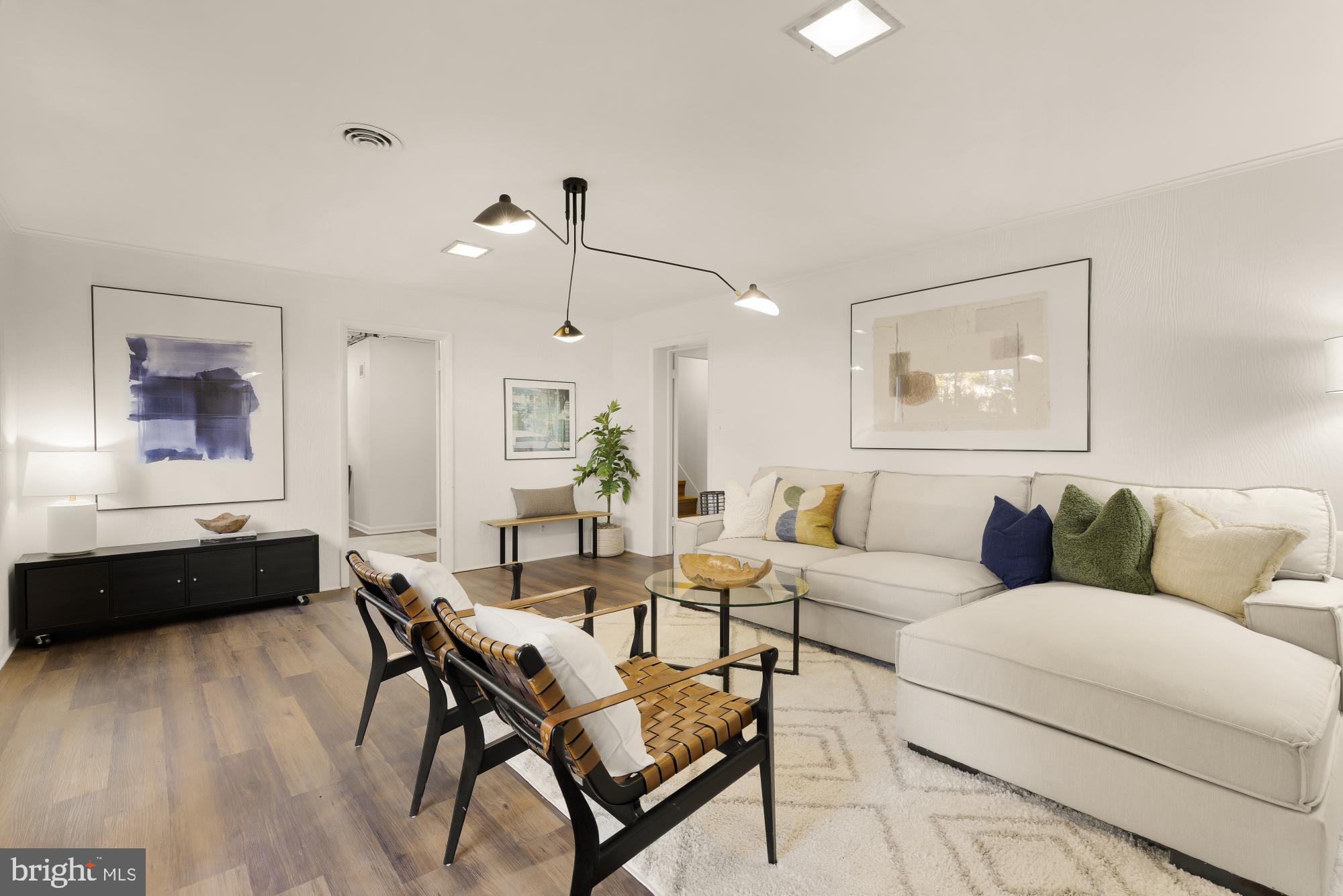 4911 Falstone Avenue Chevy Chase, MD 20815 - Photo 37 of 58 a living room with furniture and wooden floor