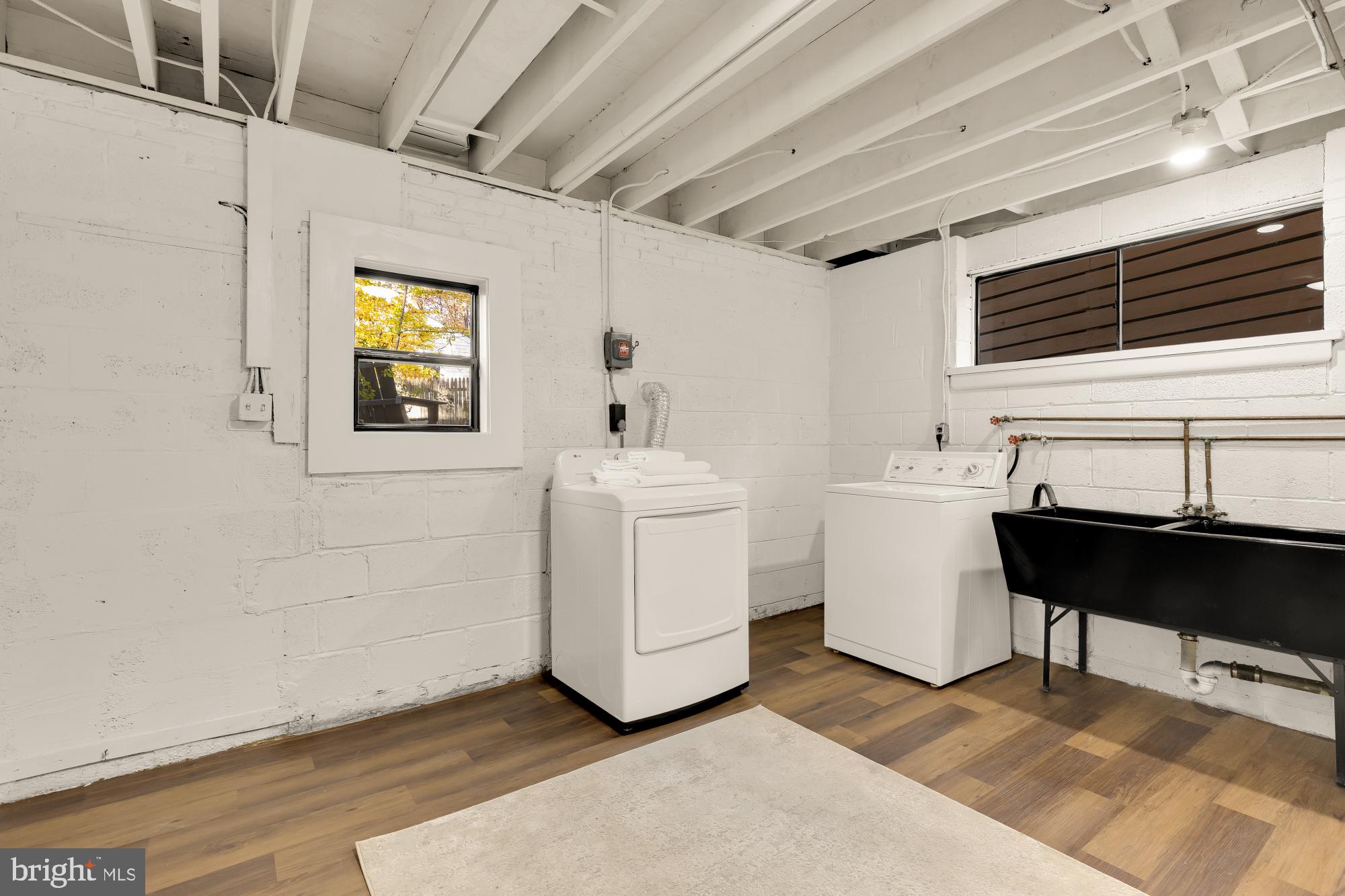 4911 Falstone Avenue Chevy Chase, MD 20815 - Photo 40 of 58 a utility room with dryer and washer