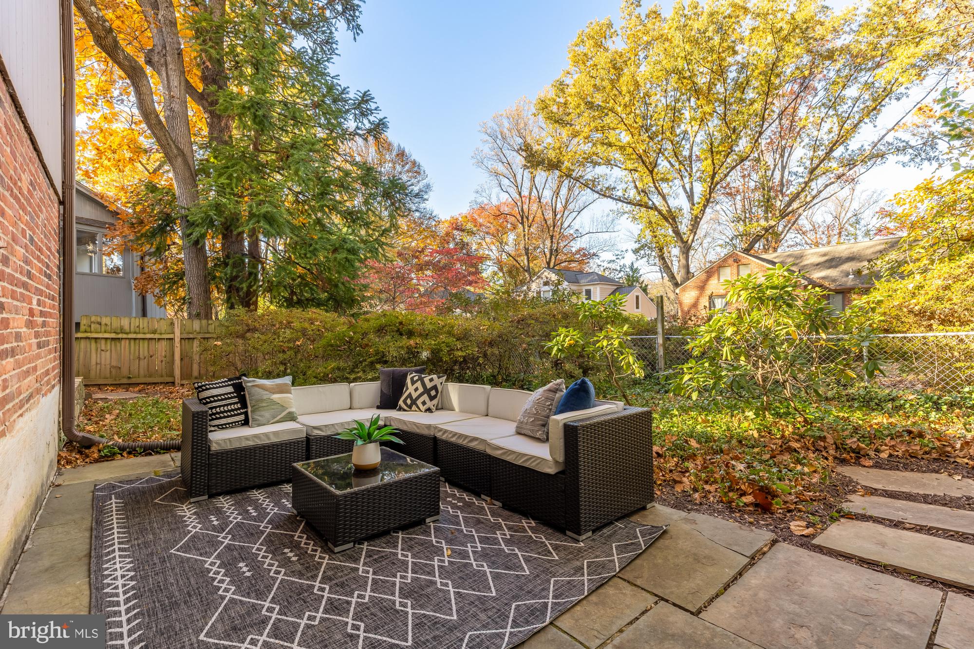 4911 Falstone Avenue Chevy Chase, MD 20815 - Photo 44 of 58 a view of a patio with couches and potted plants