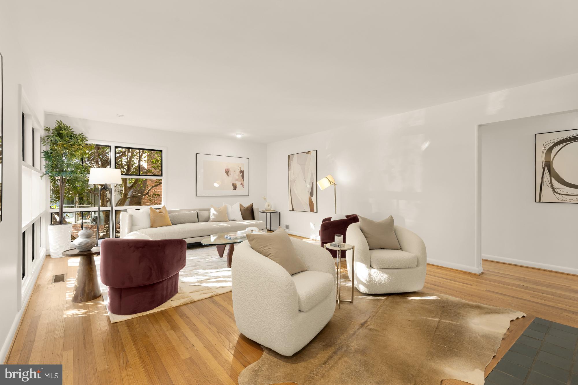 4911 Falstone Avenue Chevy Chase, MD 20815 - Photo 7 of 58 a living room with a couch and a table