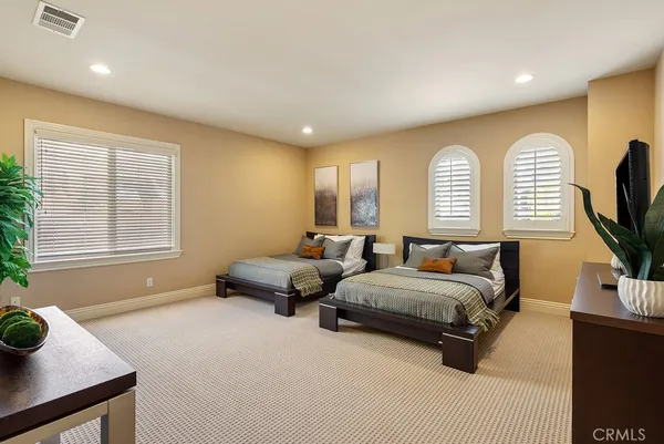 a bedroom with bed and window