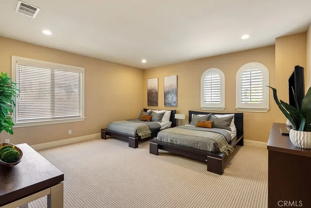 a bedroom with bed and window