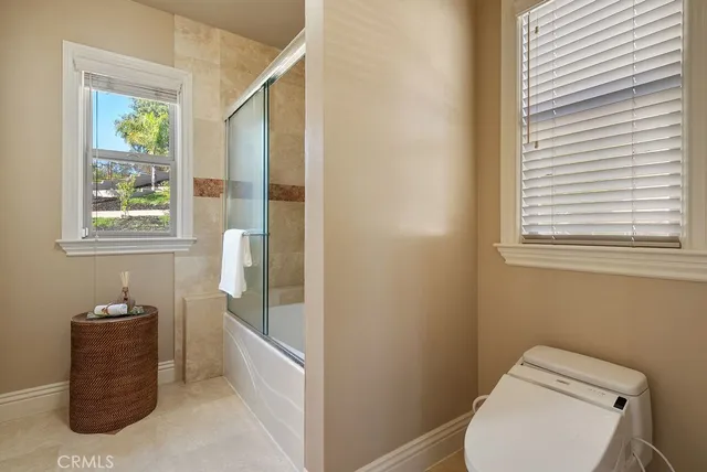 a bathroom with a toilet and a sink