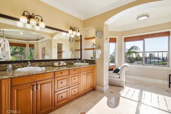 a spacious bathroom with a granite countertop tub sink and mirror