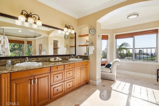 a spacious bathroom with a granite countertop tub sink and mirror