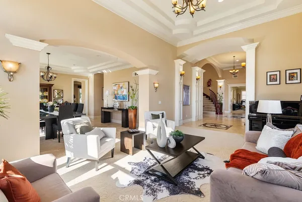 a living room with furniture and a large mirror