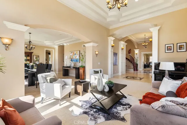 a living room with furniture and a large mirror