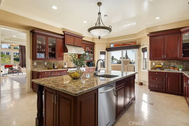 a kitchen with stainless steel appliances granite countertop counter space a sink and cabinets