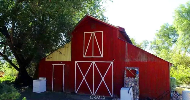 a blue sign that is on the wall of the house