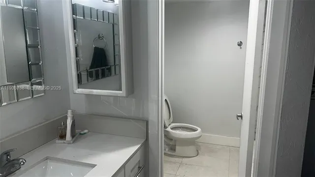 a bathroom with a sink and a toilet