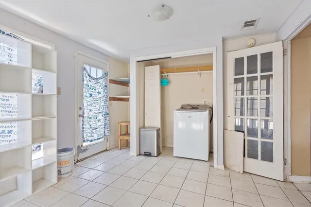 a view of an empty room with a window