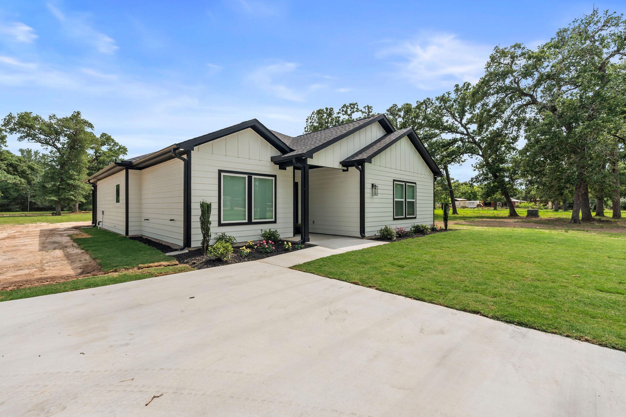 39645 Bosque Road Hempstead, TX 77445 - Photo 32 of 37 a view of a house with a yard and large tree
