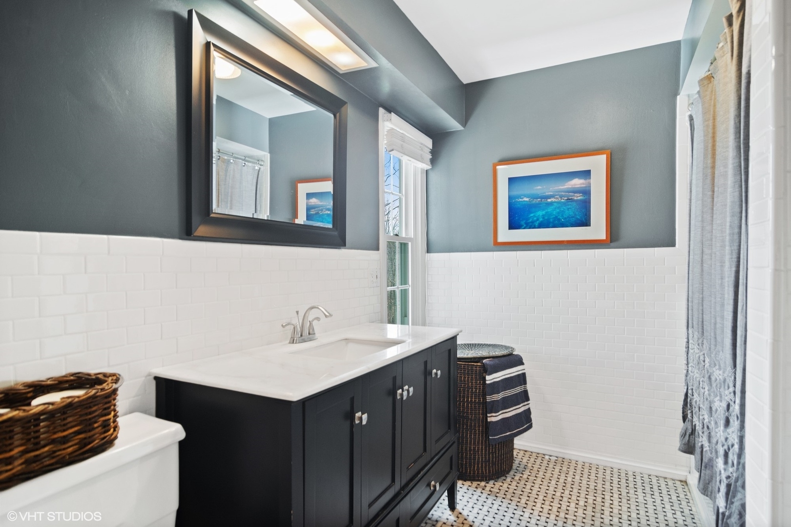 1333 West Deerpath Road Lake Forest, IL 60045 - Photo 15 of 22 a bathroom with a sink and a mirror