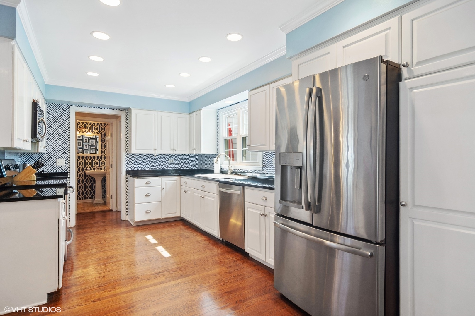 1333 West Deerpath Road Lake Forest, IL 60045 - Photo 4 of 22 a kitchen with stainless steel appliances a refrigerator sink and cabinets