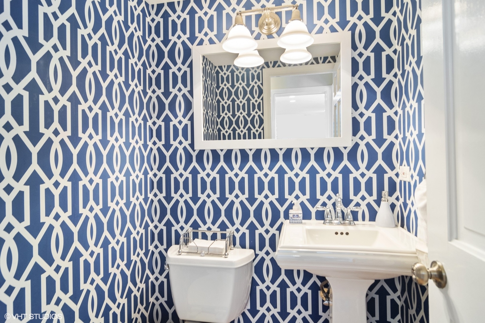 1333 West Deerpath Road Lake Forest, IL 60045 - Photo 8 of 22 a bathroom with a sink and mirror with toilet