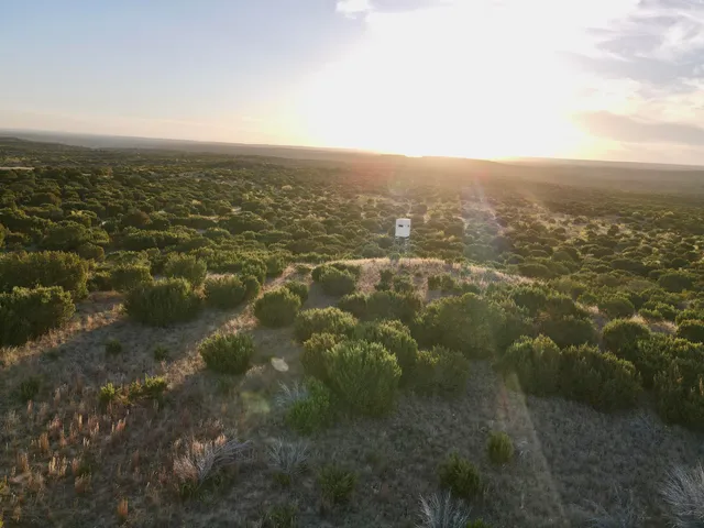an aerial view of residential houses and outdoor space