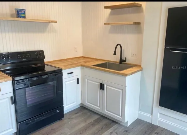 a kitchen with a sink and a stove