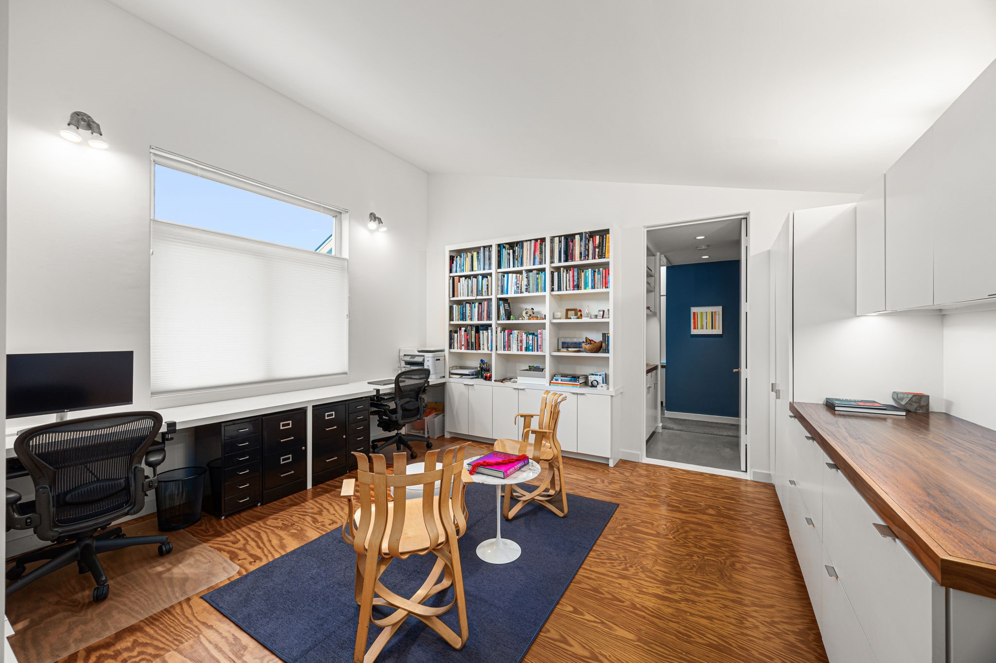 5811 Rose Street Houston, TX 77007 - Photo 25 of 38 The third floor library offers generous built-in storage on three sides, as well as abundant light through the casement windows.