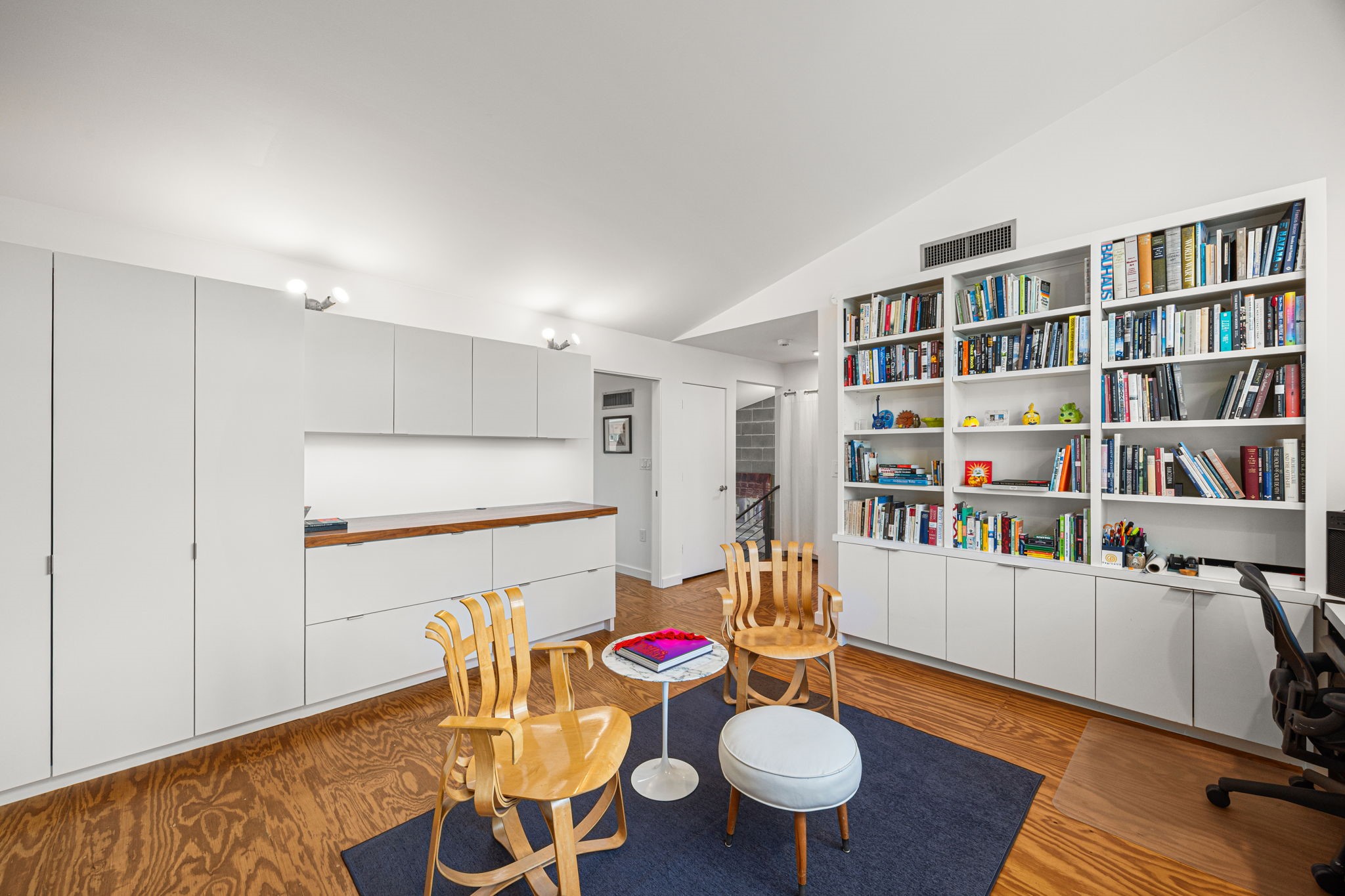 5811 Rose Street Houston, TX 77007 - Photo 27 of 38 View of the extensive additional storage space in the library, highlighting the loftiness provided by the vaulted ceiling.