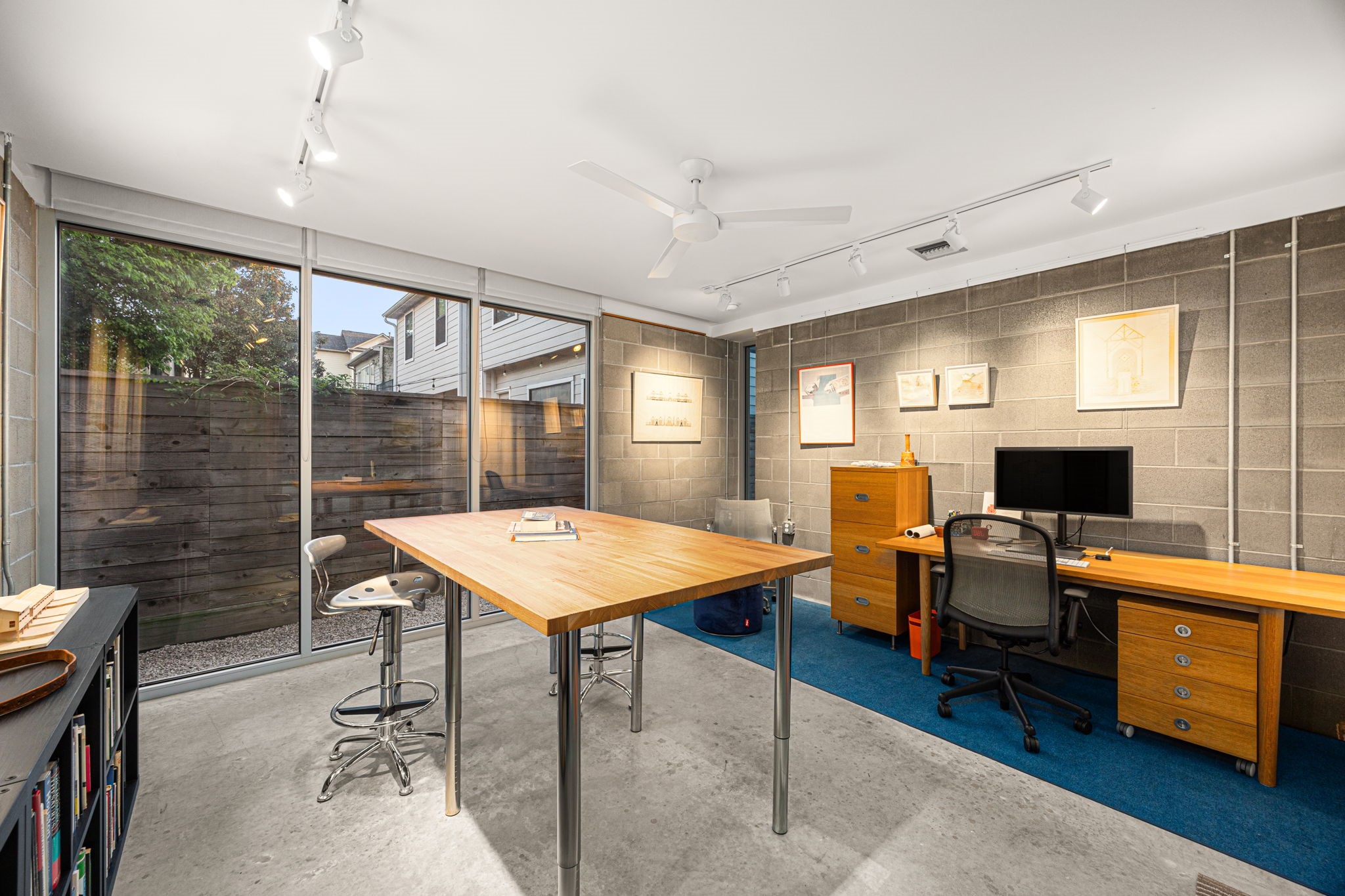 5811 Rose Street Houston, TX 77007 - Photo 33 of 38 The first floor independent work/studio space previously used as an architect firm. Keep it as a office, or flex it into a hobby room, home gym...the options are endless.