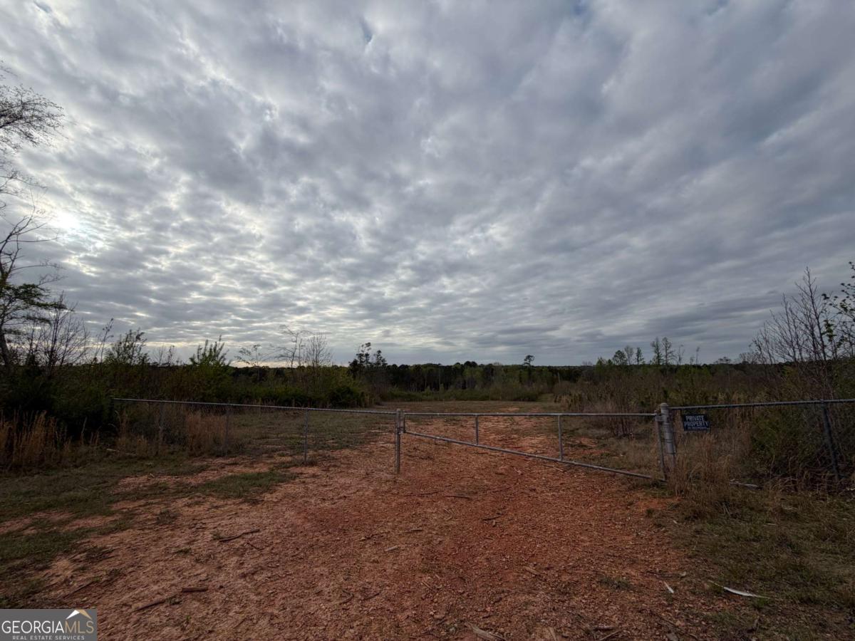 0 Lunceford Road Northeast Rayle, GA 30660 - Photo 6 of 7 a view of a lake with table and chairs