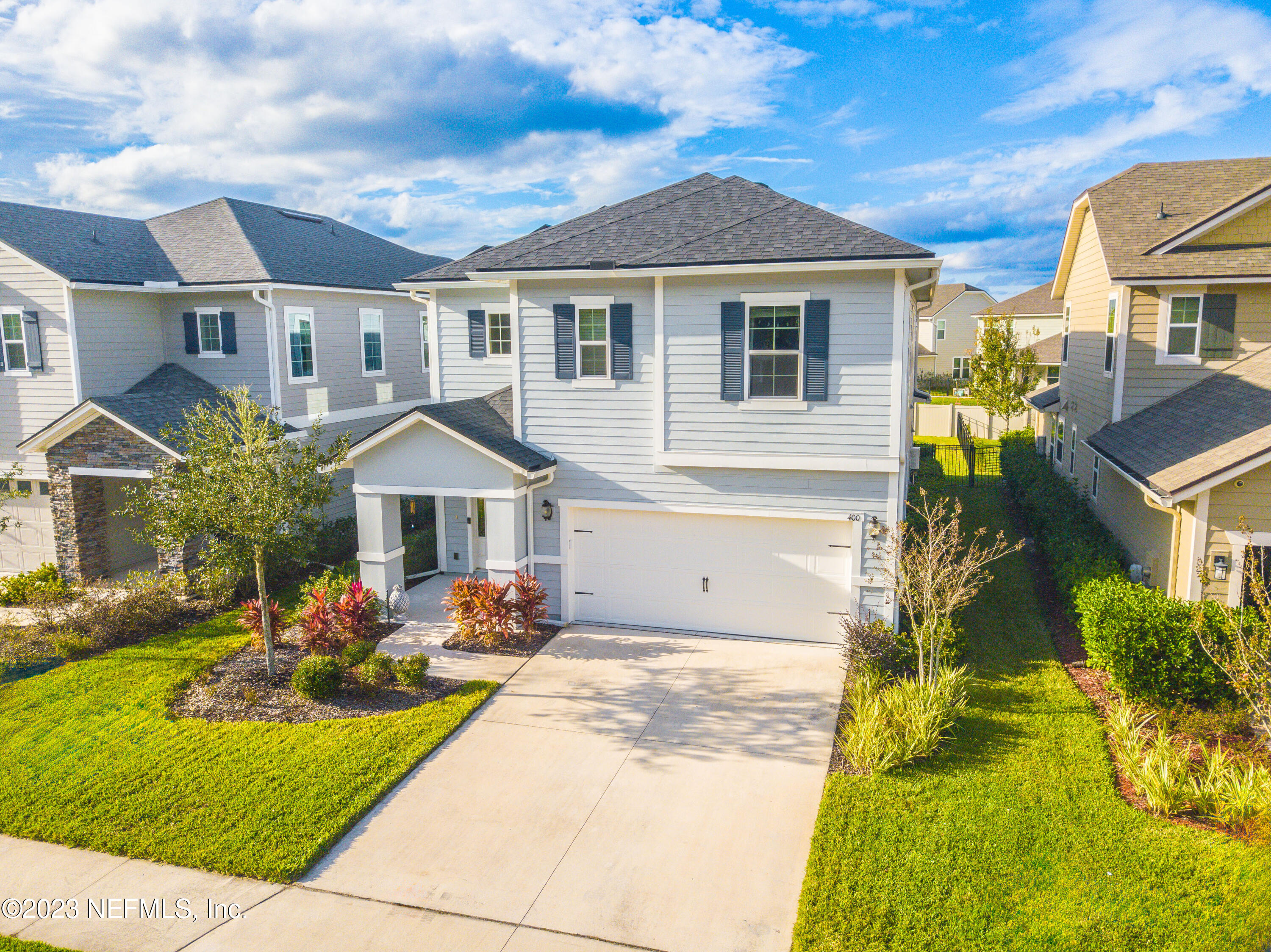 a front view of a house with sitting area