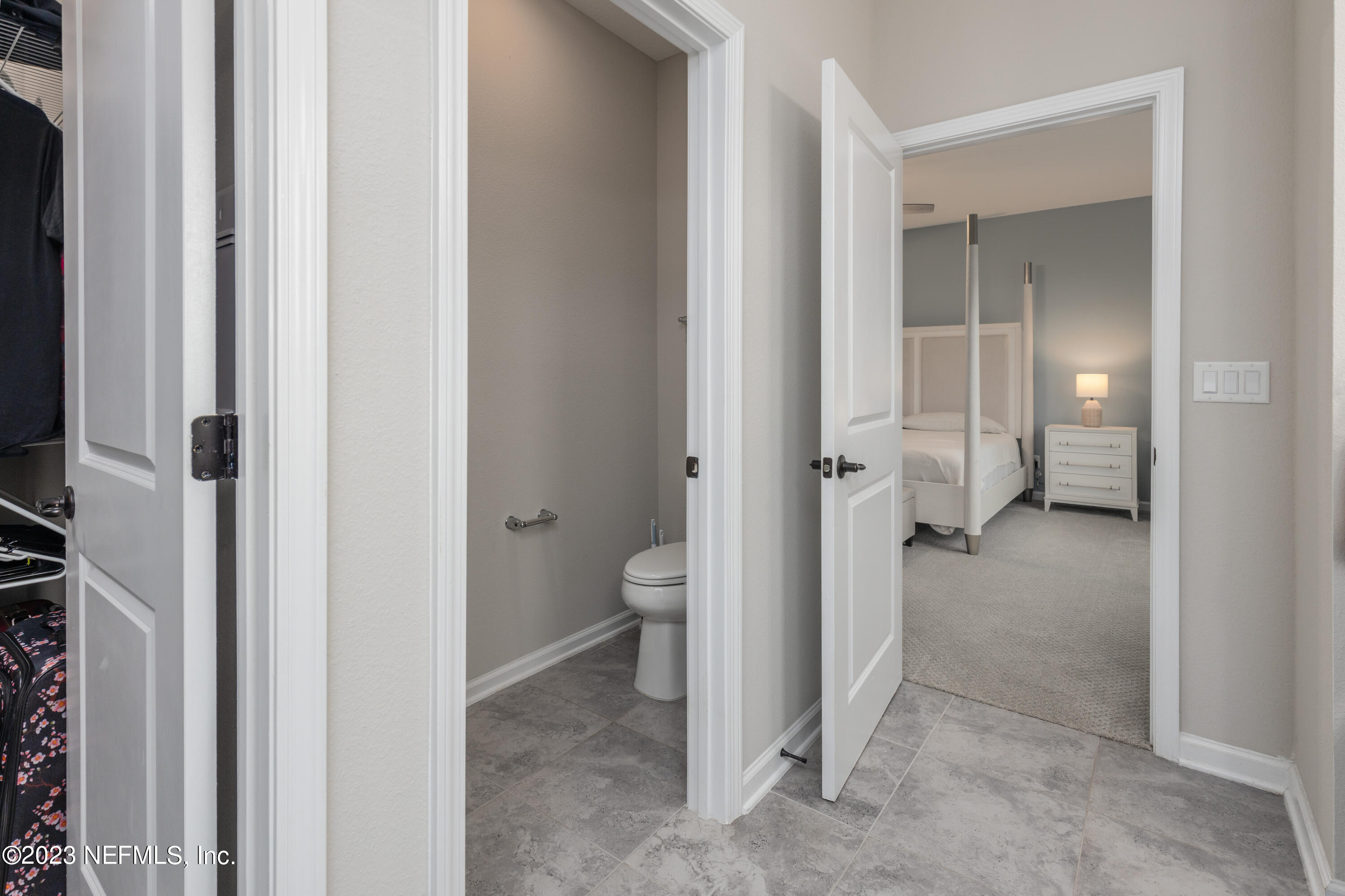 400 Weathered Edge Drive St. Augustine, FL 32092 - Photo 14 of 35 a view of a bathroom with a toilet and a sink