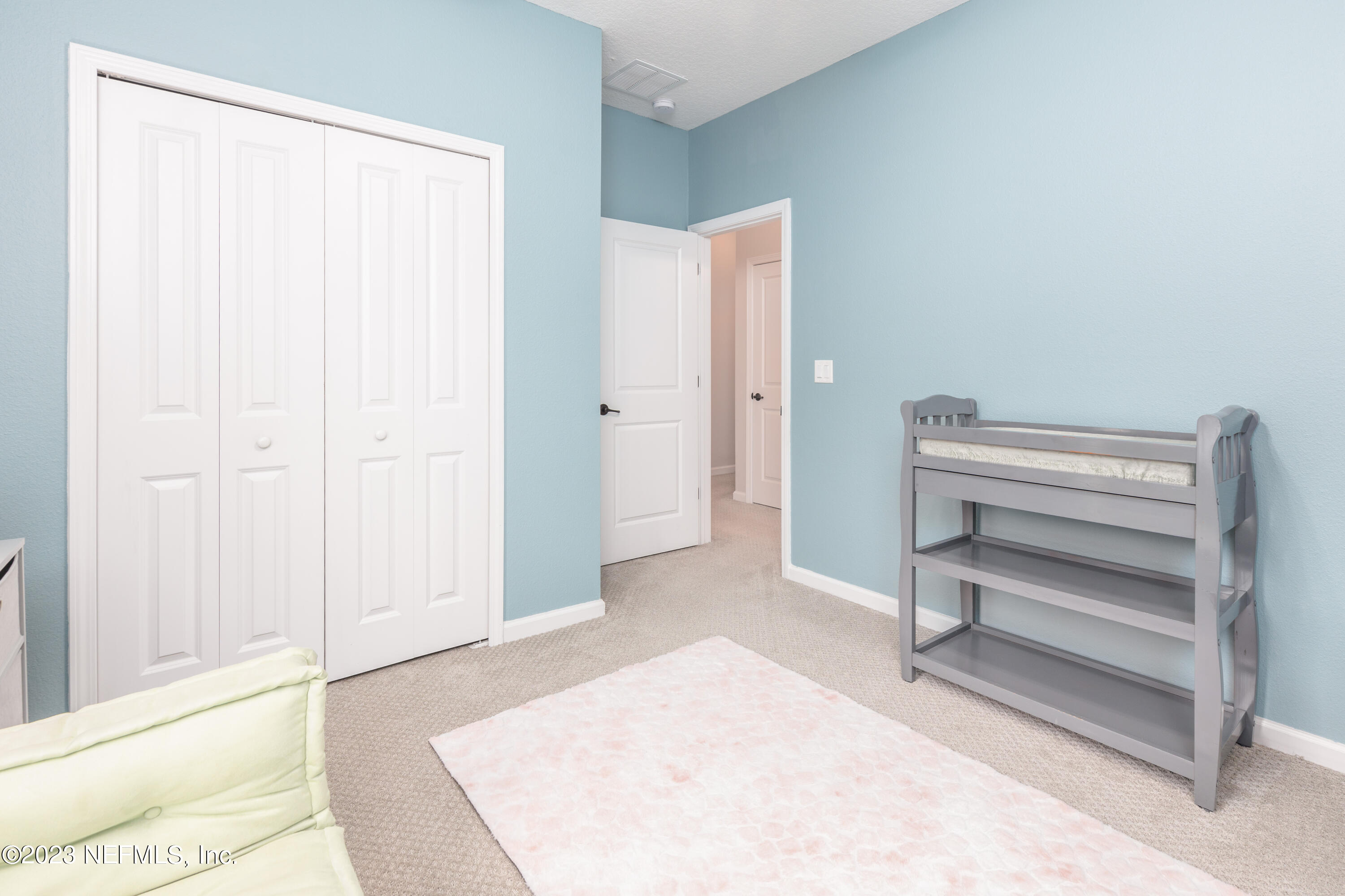 400 Weathered Edge Drive St. Augustine, FL 32092 - Photo 17 of 35 a view of a bedroom with wooden floor and closet