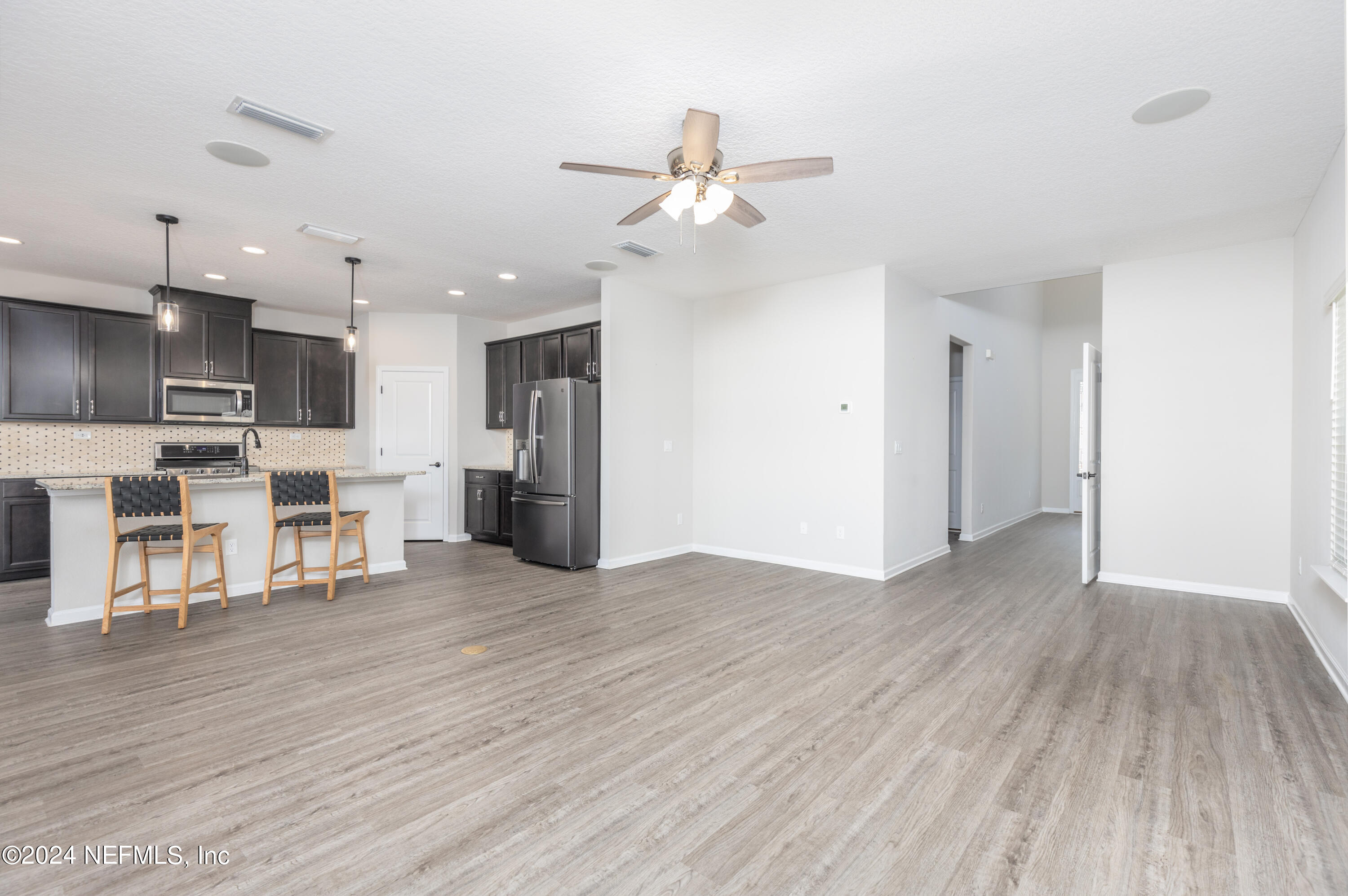 400 Weathered Edge Drive St. Augustine, FL 32092 - Photo 20 of 35 a view of a kitchen with wooden floor and a kitchen