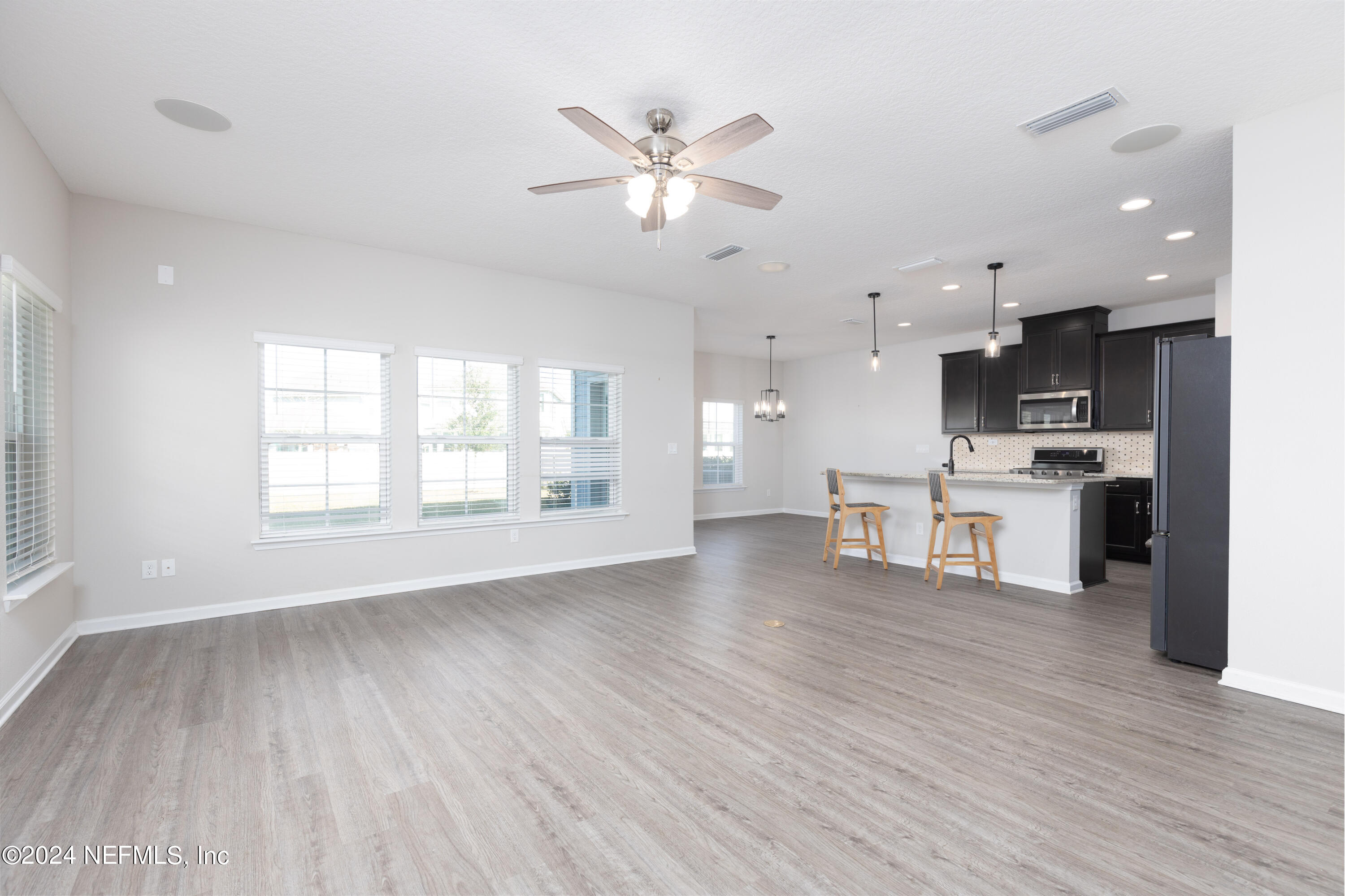 400 Weathered Edge Drive St. Augustine, FL 32092 - Photo 21 of 35 a view of kitchen with cabinets and wooden floor