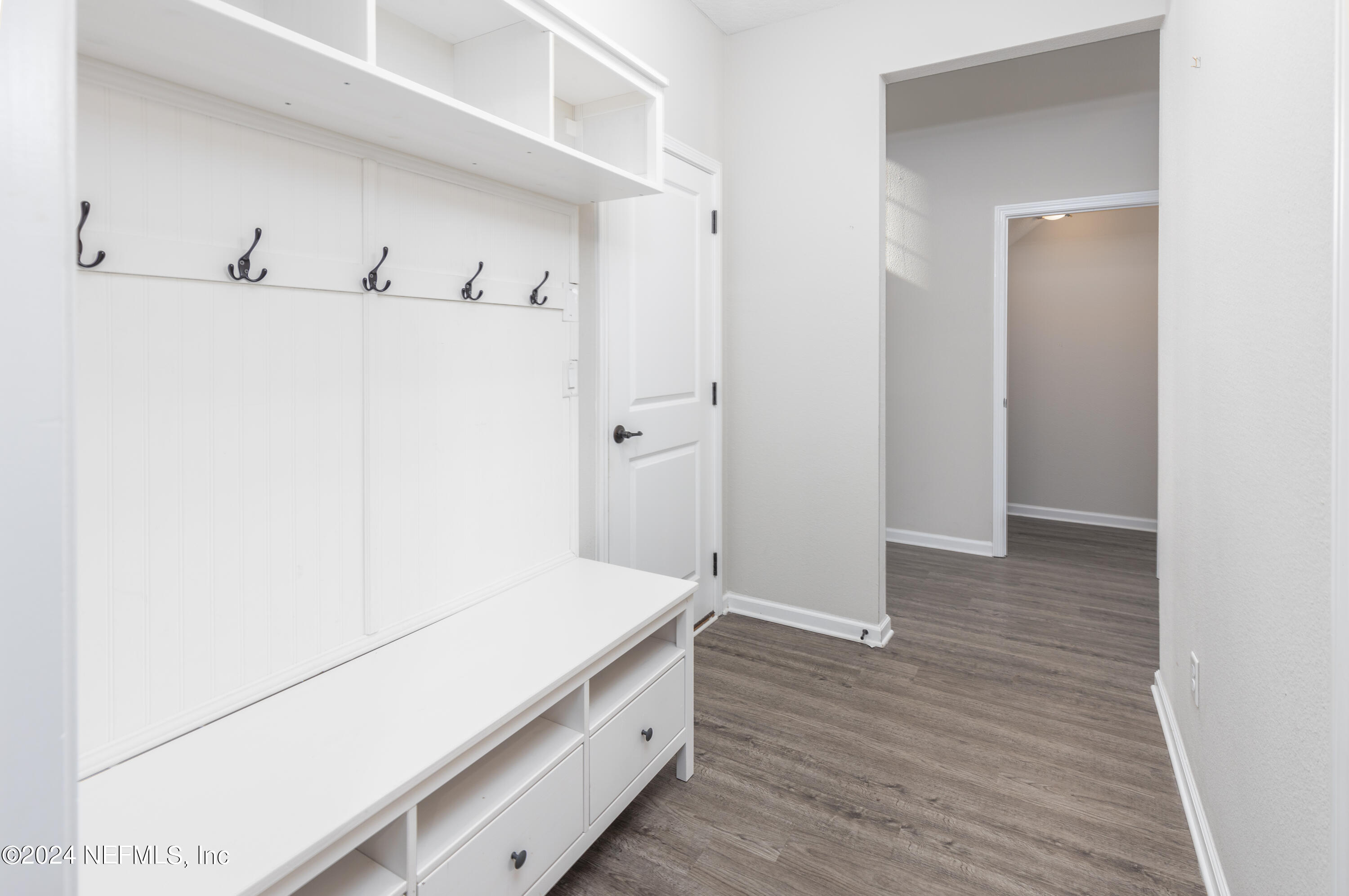 400 Weathered Edge Drive St. Augustine, FL 32092 - Photo 8 of 35 a room with a closet and wooden floor