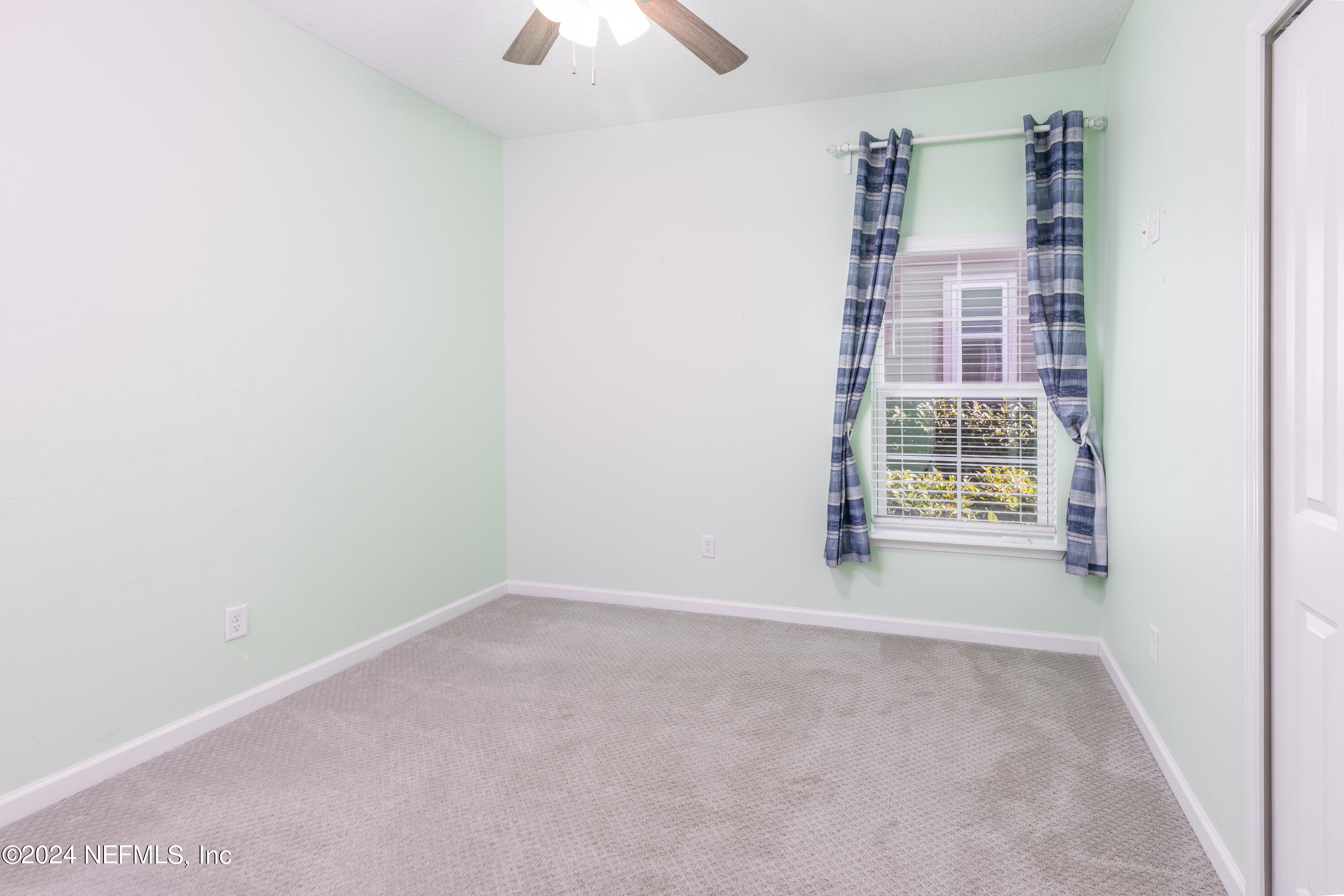 400 Weathered Edge Drive St. Augustine, FL 32092 - Photo 10 of 35 an empty room with windows