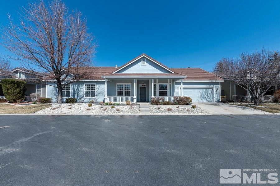 1487 Wild Wolf Way Reno, NV 89521 - Photo 1 of 39 a front view of a house with a yard