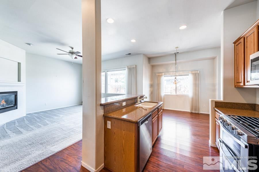 1487 Wild Wolf Way Reno, NV 89521 - Photo 17 of 39 a view of a kitchen cabinets and wooden floor