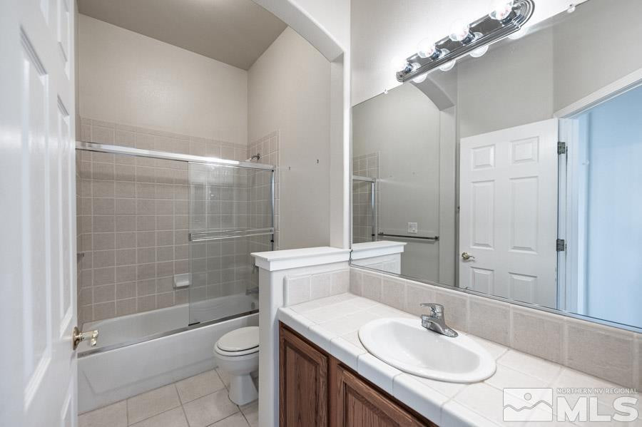 1487 Wild Wolf Way Reno, NV 89521 - Photo 27 of 39 a bathroom with a sink a toilet and shower