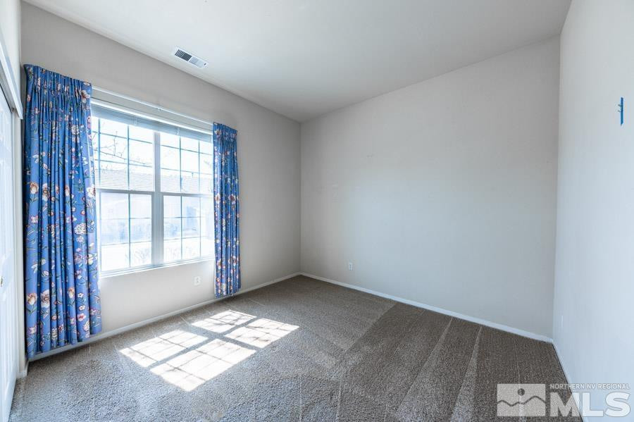 1487 Wild Wolf Way Reno, NV 89521 - Photo 29 of 39 a view of an empty room and a window