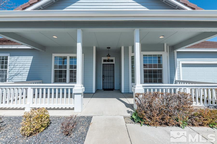 1487 Wild Wolf Way Reno, NV 89521 - Photo 3 of 39 a view of a house with porch and wooden floor
