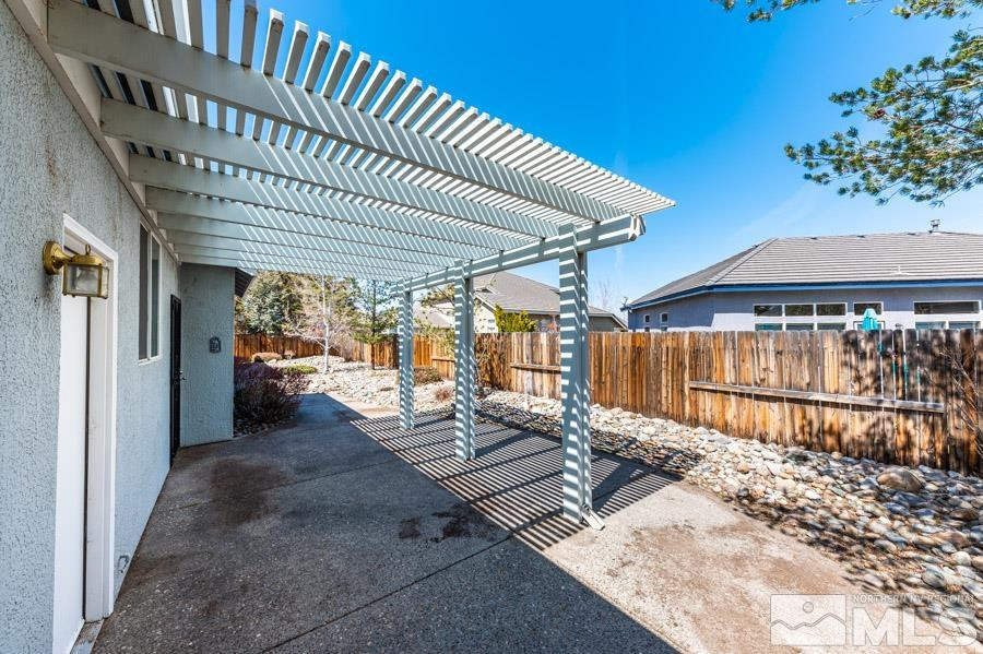 1487 Wild Wolf Way Reno, NV 89521 - Photo 32 of 39 a view of a porch with wooden floor