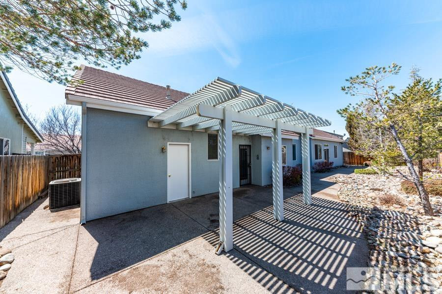 1487 Wild Wolf Way Reno, NV 89521 - Photo 33 of 39 a front view of a house with a porch