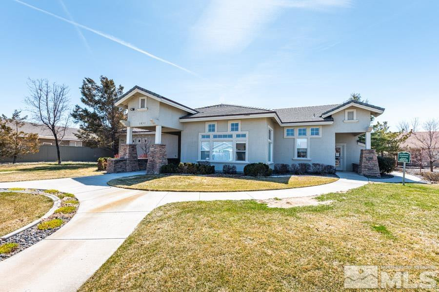 1487 Wild Wolf Way Reno, NV 89521 - Photo 36 of 39 a front view of a house with a yard